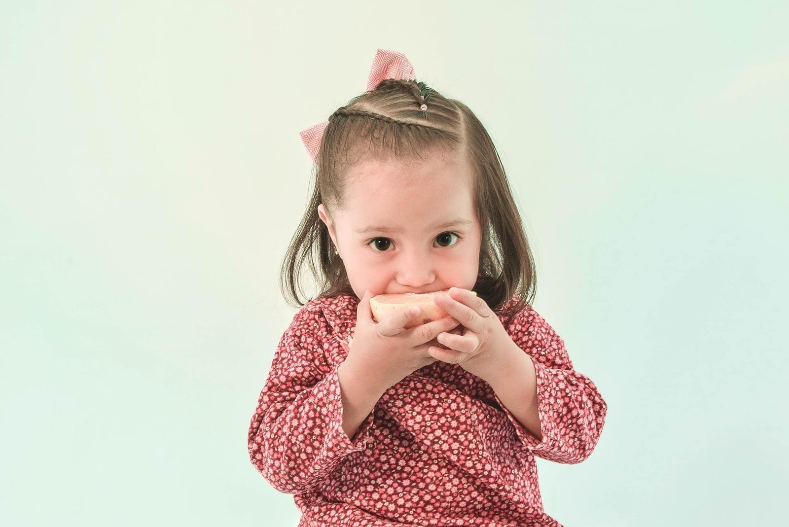 kid eating fruit